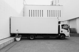 Delivery truck parked near a warehouse
