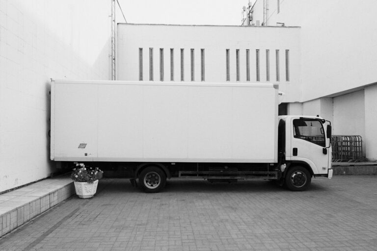 Delivery truck parked near a warehouse
