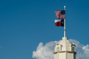 American and Texas flags outside a courthouse in Texas