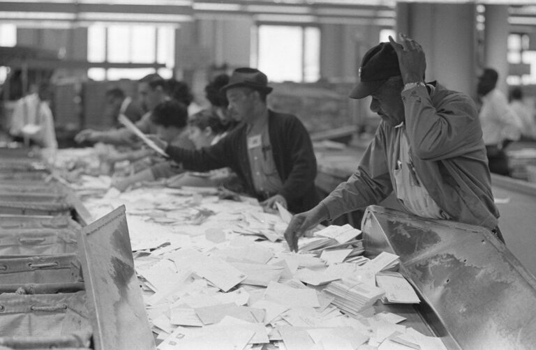 American workers sorting mail at a workplace